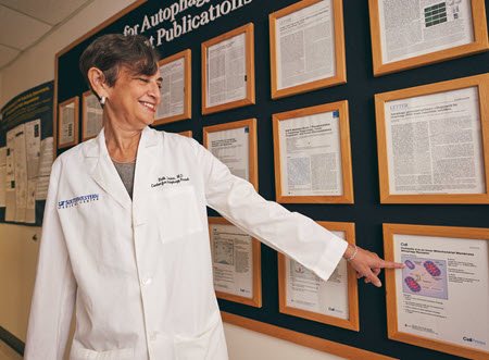 Woman Doctor pointing at a notice